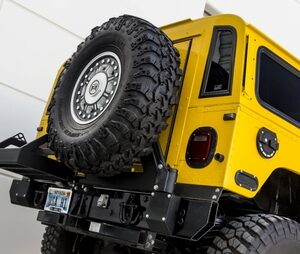 Predator Hummer H1 H1 Drop Down Tire Carrier. Jerry Can Carrier not included.